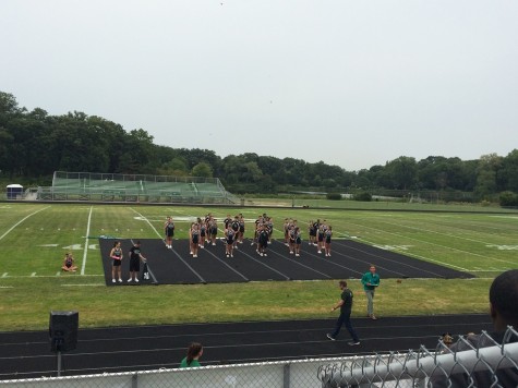 The cheerleaders begin performing for the crowd 