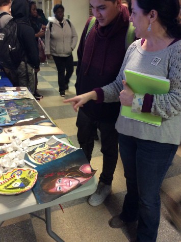Mrs. Doyle explains to a student about the different art classes West offers to students who are interested