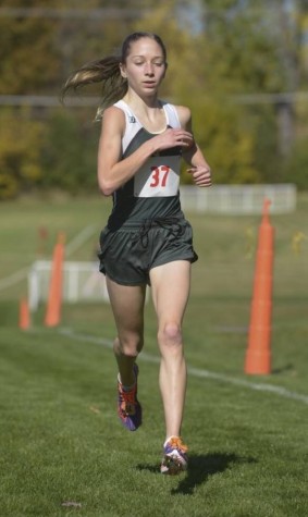 Lindsay Graham, senior, running in a Cross Country event 