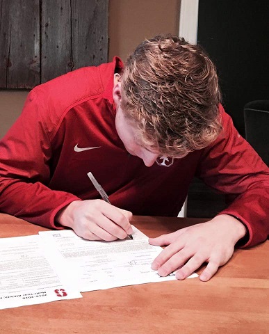 Paul Bischoff, senior, signs his National Letter of Intent to play volleyball at Stanford University. 