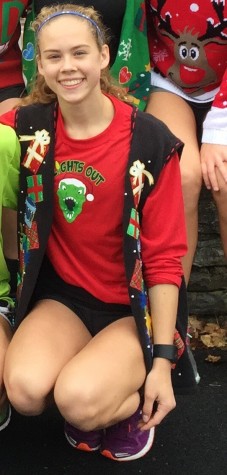 West Student poses in her festive Christmas vest 