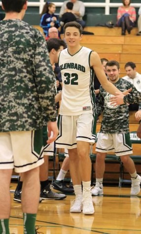 Justin, senior and number 32, high-fives his teammates after another big win this season. 