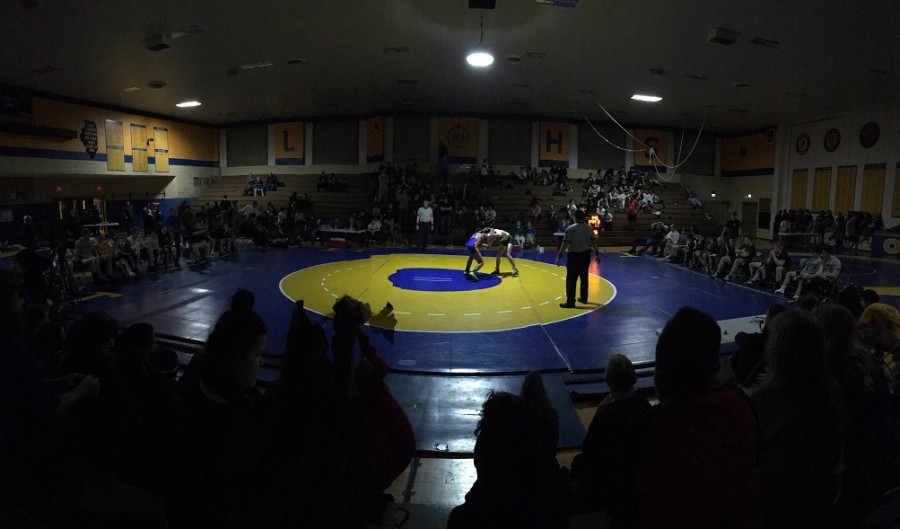 West Wrestlign faces off against Lions Township at conference. 