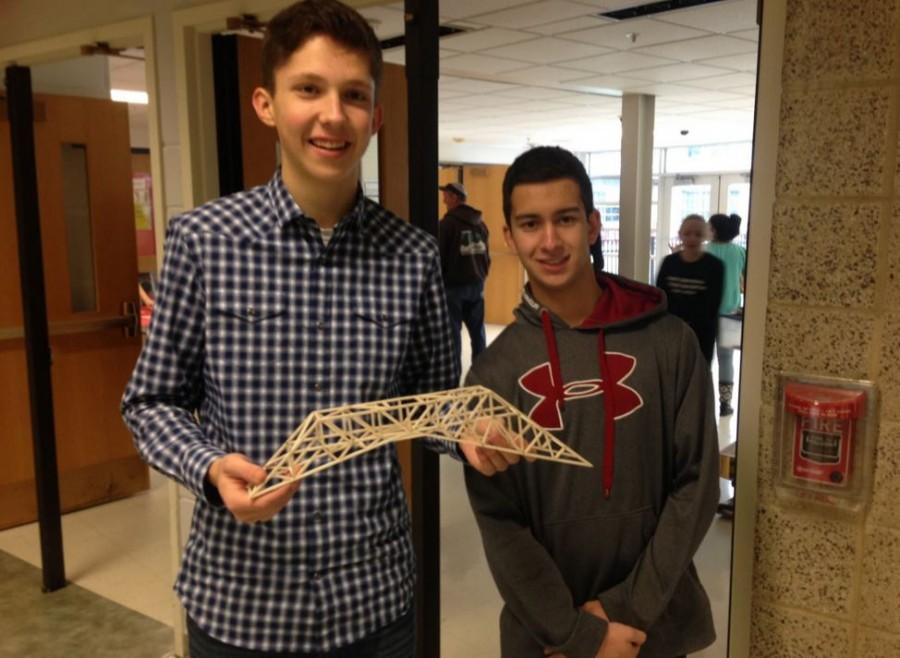 Seniors, Geoffrey Shellady (left) and Alex Lettenberger (right), pose with their model for a Science Olympiad Competition. 