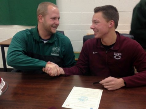 Arno and Coach Schultz shake hands on Curtis' UChicago signing day. 