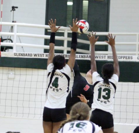 Quiana Ware (4) goes up for a block alongside her fellow West teammate. 