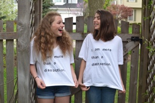 Emily Davidson and Roxy Geballe with their protest shirts.