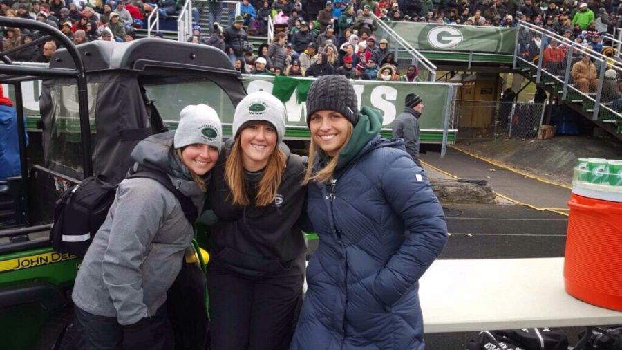 (From left to right) Jen Bednarek, Heather Jenkins,  and Alli Jones pose for a picture at a Glenbard West football game.