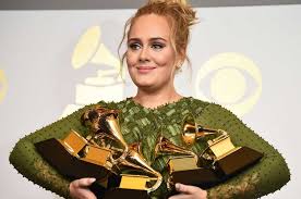 Adele holds her 5 Grammy Awards at the 2017 Grammy Music Awards.
(Grammy.com)