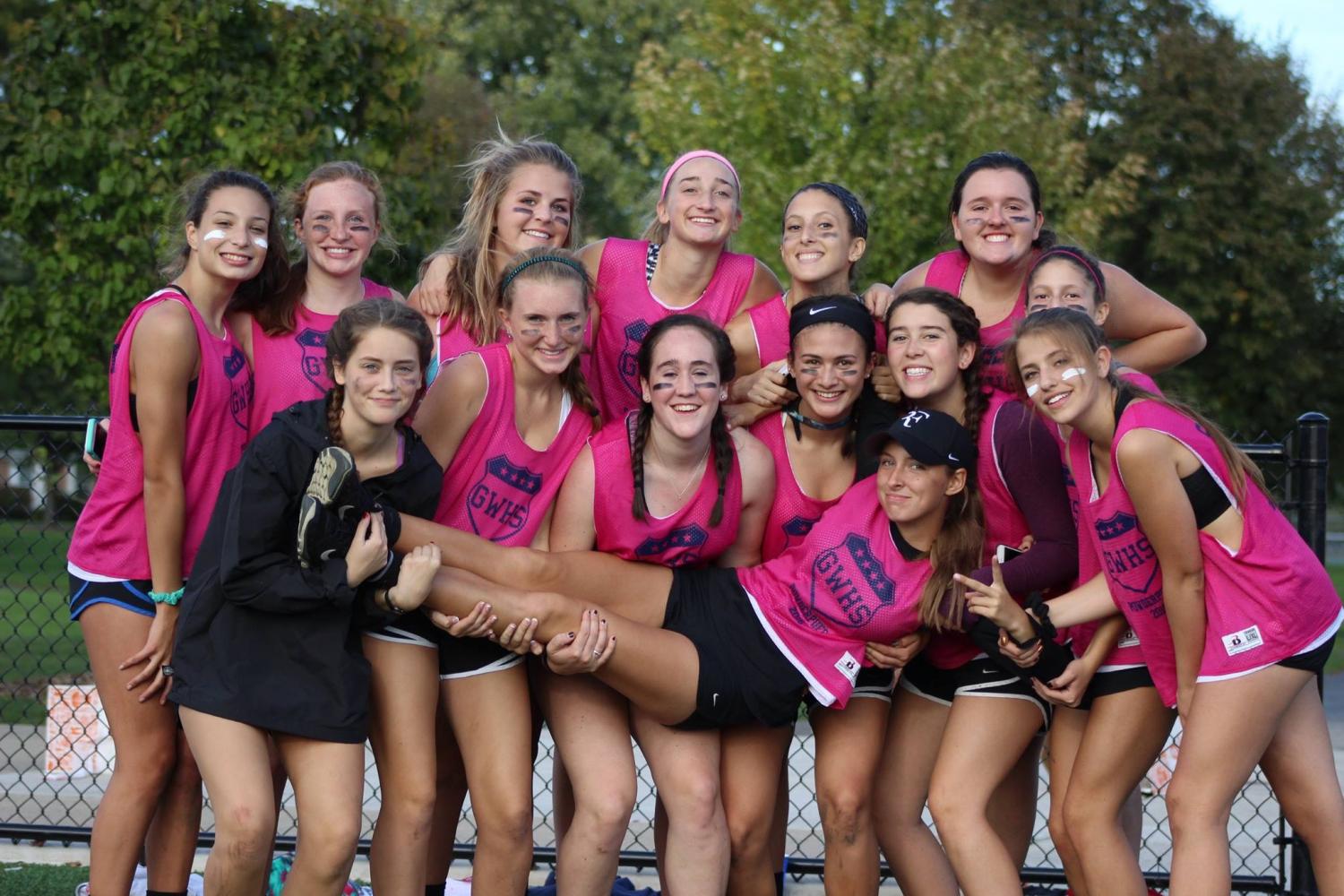 A 2016 Powderpuff Junior team poses for a group picture at last years event