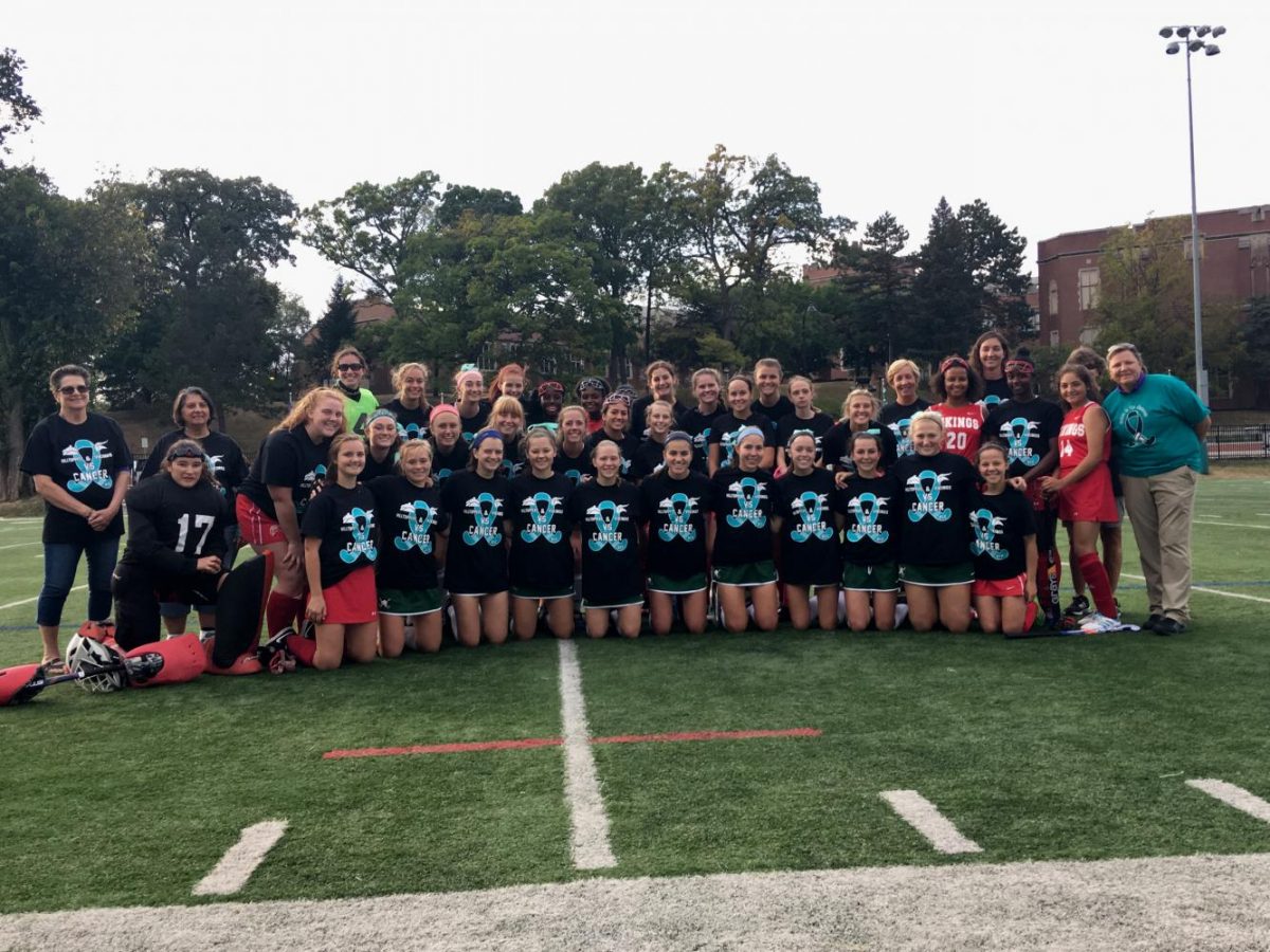 Wests varsity field hockey team with Homewood Flossmoors Vikings. Coach Leah Carter, in whose honor the event was started, is on the far right.