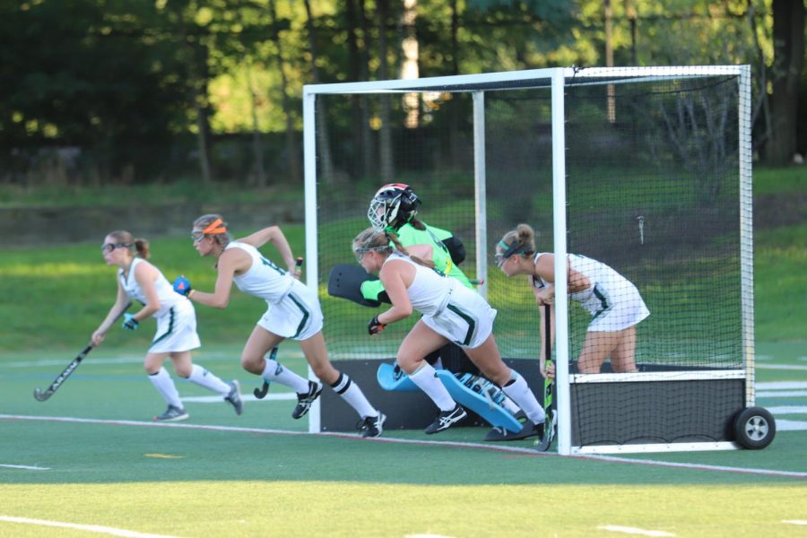 Glenbard West defense and Goalie Ellie Ostroff (senior) rushes out of the goal.