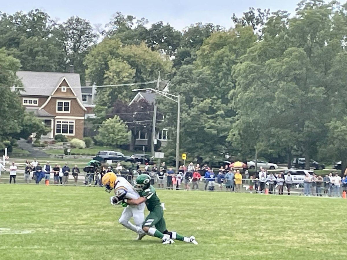West player tackles a defender’s reception.