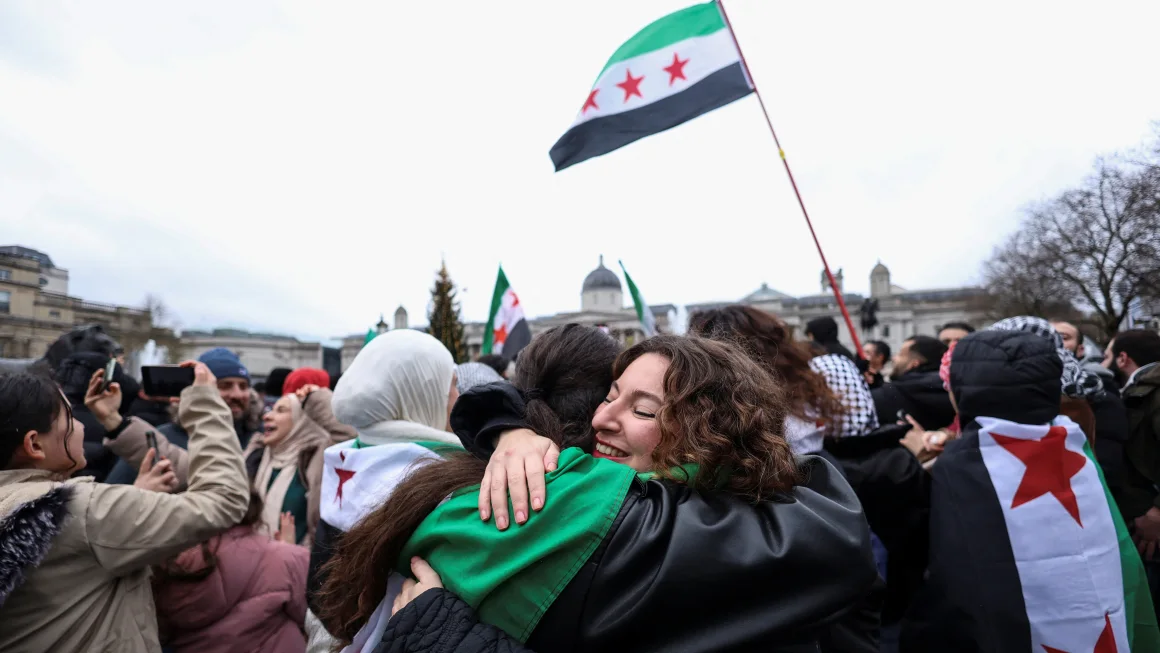 Syrian refugees celebrating the fall of Assad's Regime.  All rights reserved to Mina Kim/Reuters