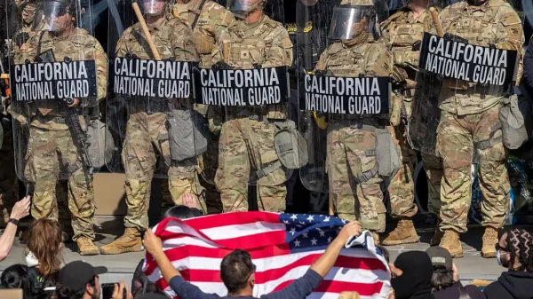 Protesters confront California National Guard soldiers and police outside of a federal building as protests continue in Los Angeles following three days of clashes with police after a series of immigration raids on June 09, 2025 in Los Angeles, California.  Getty Images, David McNew. All rights reserved to Getty Images and David McNew.